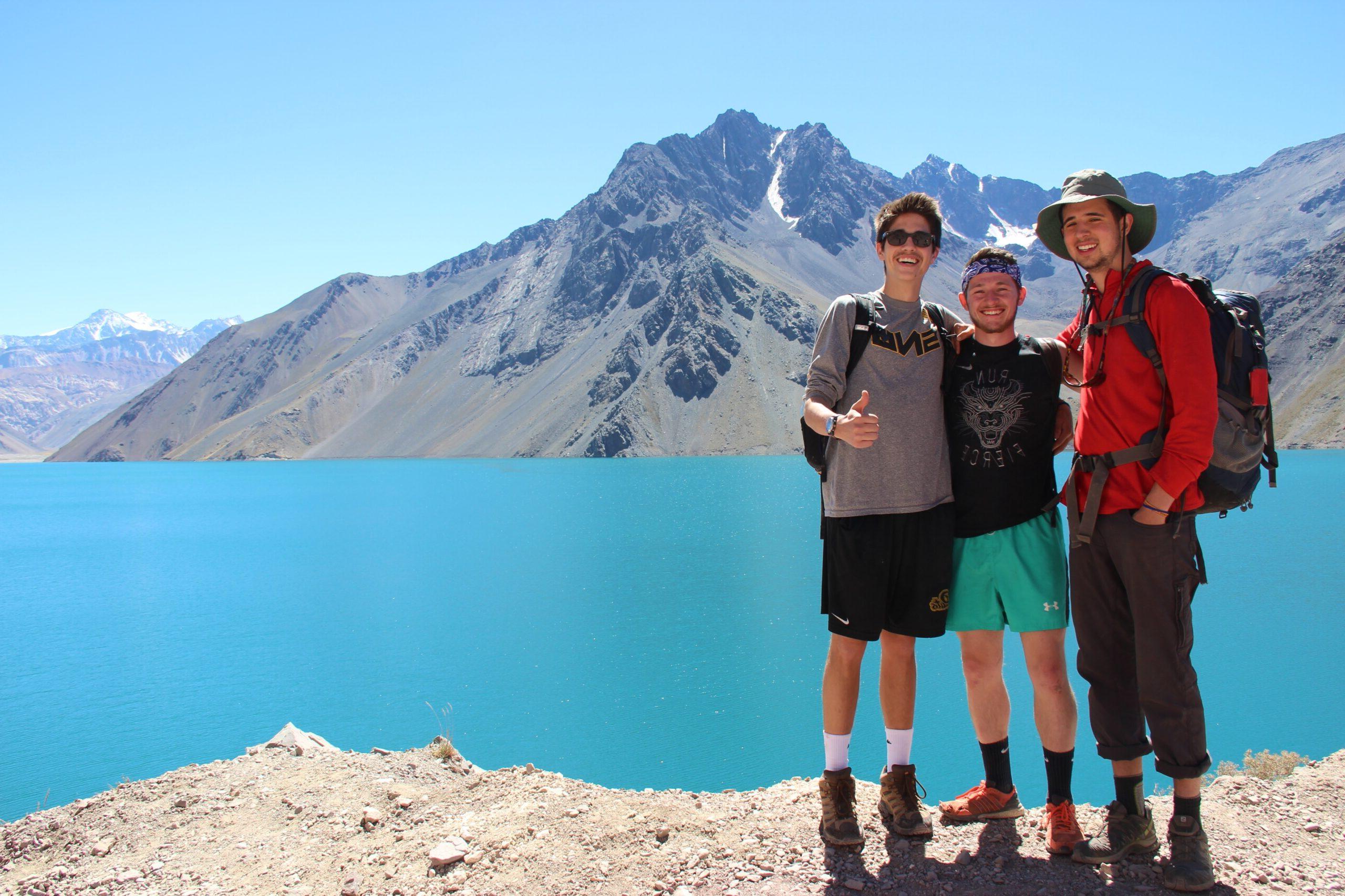 Students standing near a mountain